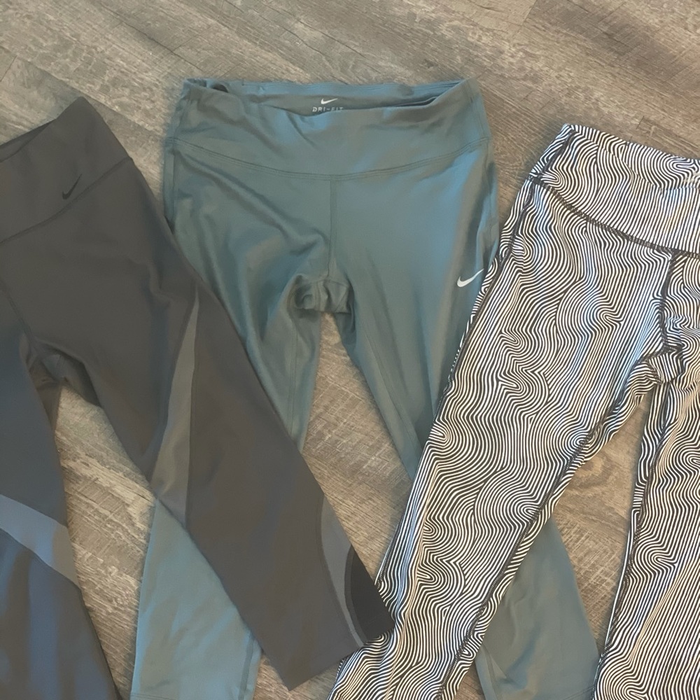 THREE PAIRS OF NIKE ATHLETIC LEGGINGS